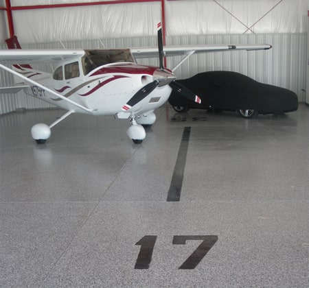 Schweiss Hangar Home has custom floor and unique paint job