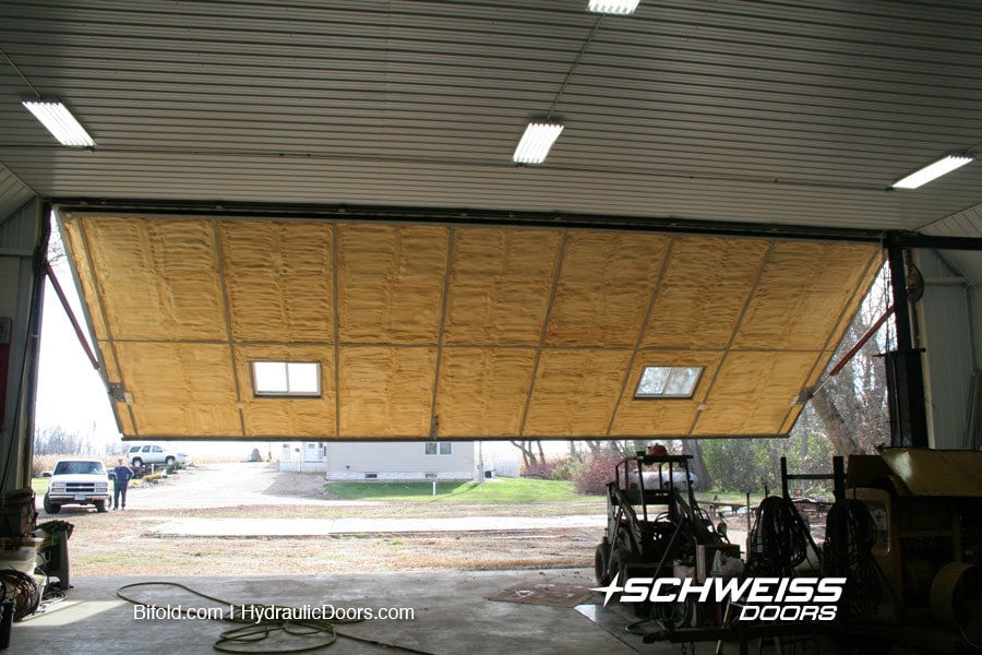 Schweiss insulated door and in-floor heating keep building warm.